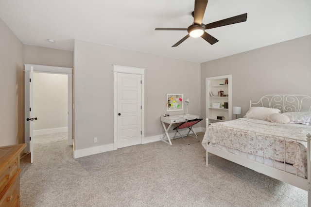 bedroom with ceiling fan and light colored carpet