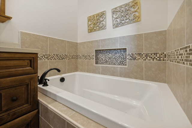 bathroom with tiled bath