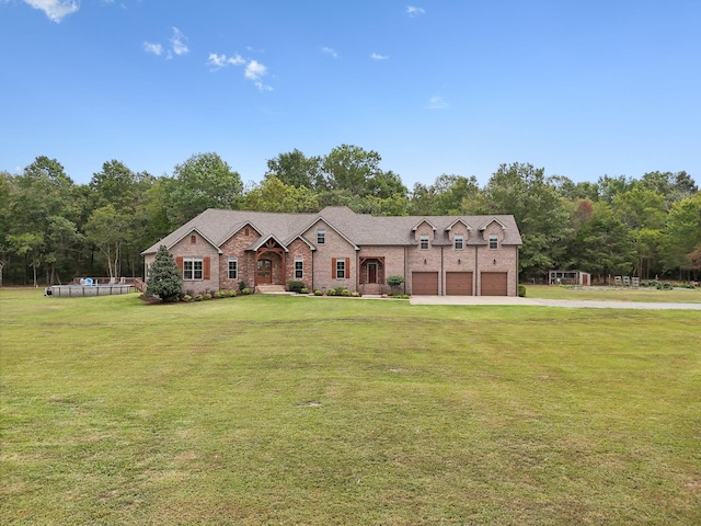 view of front facade with a garage and a front lawn