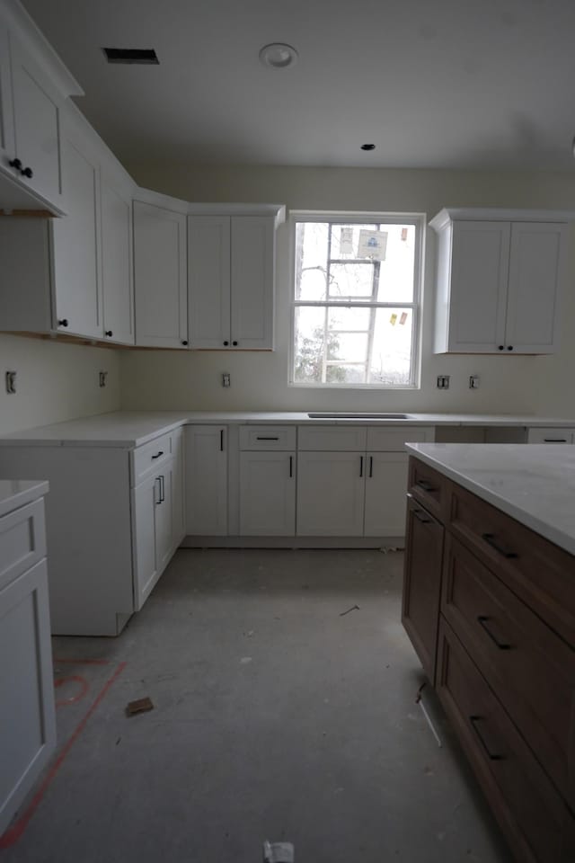 kitchen featuring white cabinets