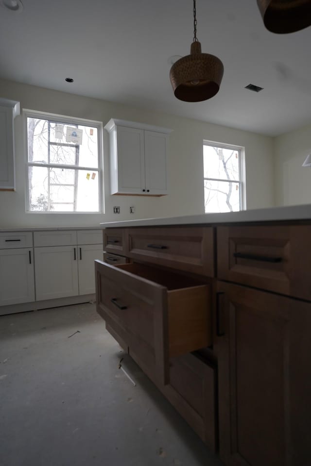 kitchen featuring white cabinets