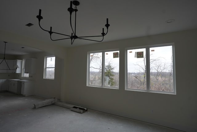 interior space with a chandelier