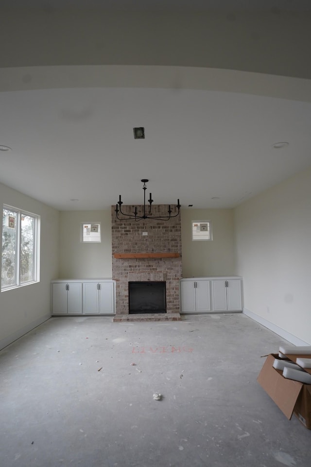 unfurnished living room featuring a fireplace