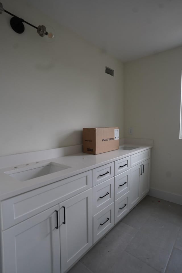 bathroom featuring tile patterned floors and vanity