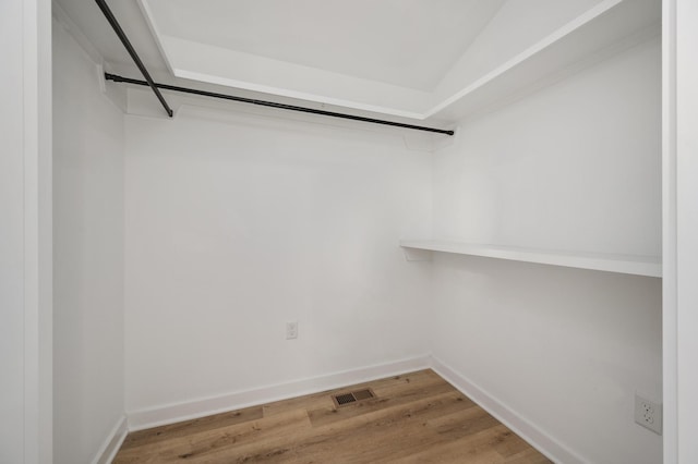 spacious closet featuring hardwood / wood-style flooring