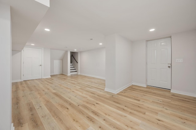 basement featuring light wood-type flooring