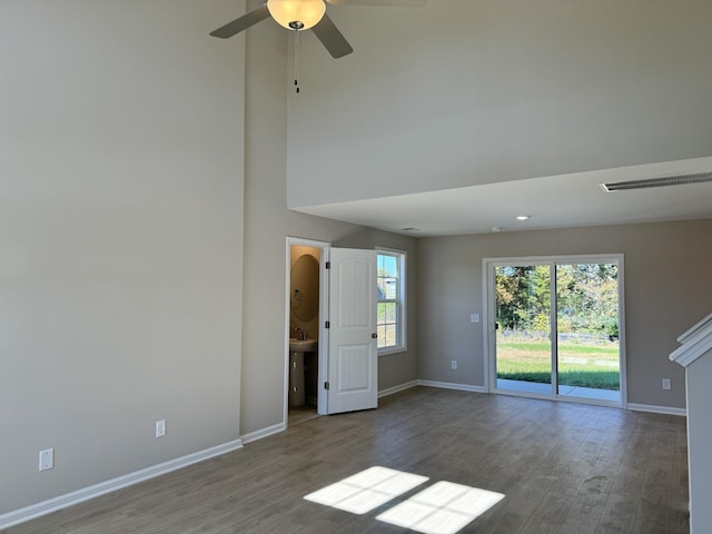 unfurnished room with hardwood / wood-style floors and ceiling fan