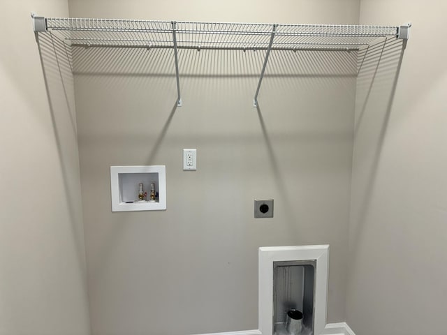 clothes washing area with hookup for an electric dryer and washer hookup