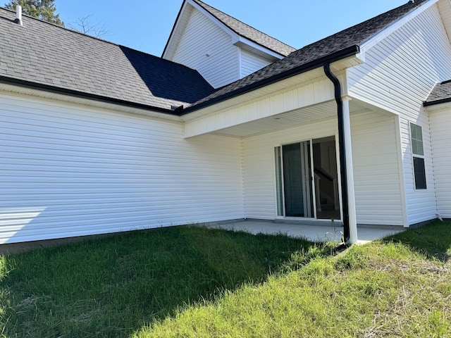 rear view of house with a lawn