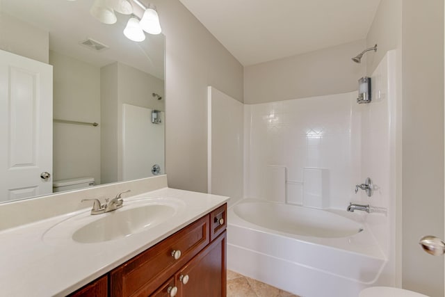 full bathroom with tile patterned floors, vanity,  shower combination, and toilet