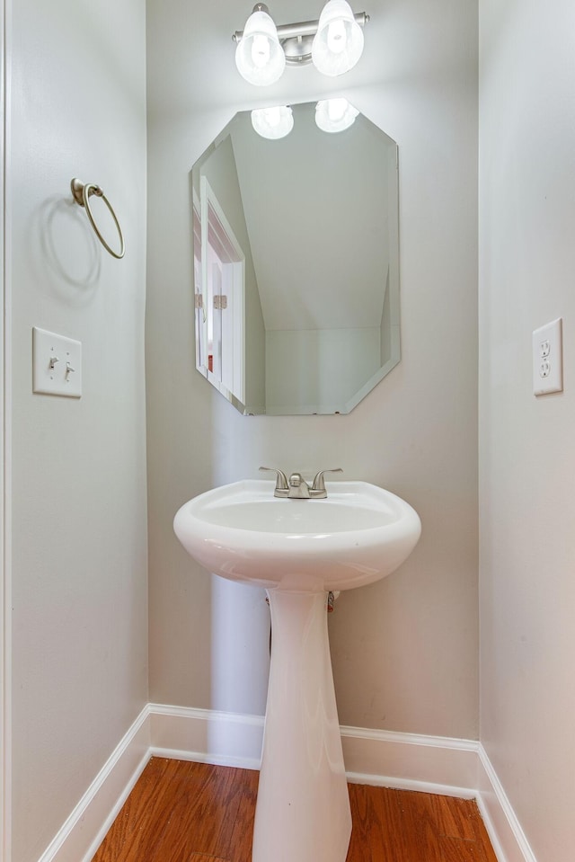 bathroom with hardwood / wood-style floors and sink