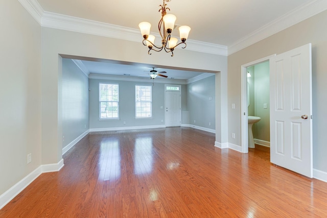 unfurnished room featuring hardwood / wood-style flooring, ceiling fan with notable chandelier, and crown molding