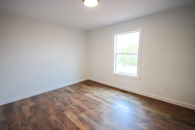 empty room featuring dark hardwood / wood-style floors