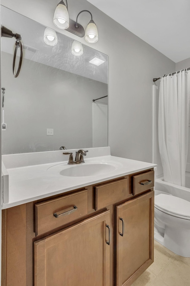 full bathroom with shower / bathtub combination with curtain, vanity, and toilet