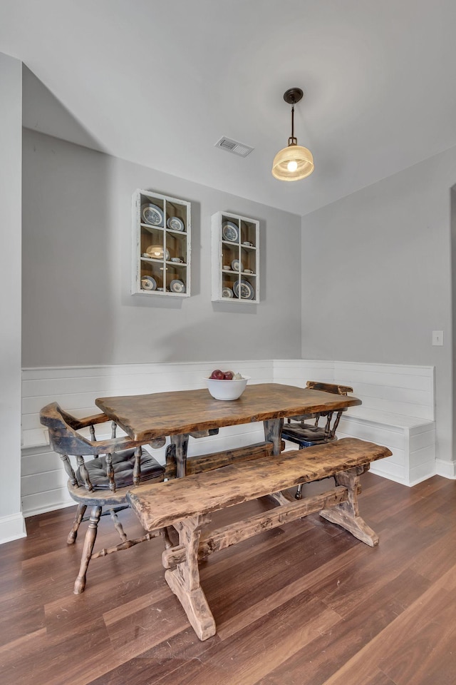 dining area with dark wood-type flooring