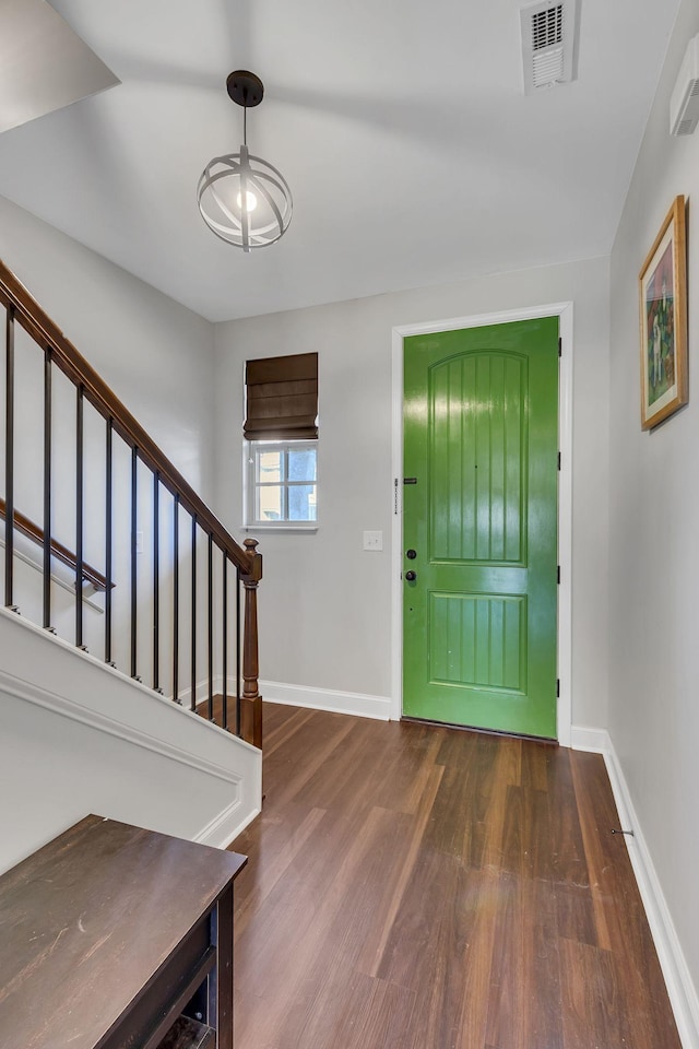 foyer entrance featuring dark hardwood / wood-style flooring