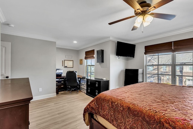 bedroom with light hardwood / wood-style floors, ceiling fan, and crown molding