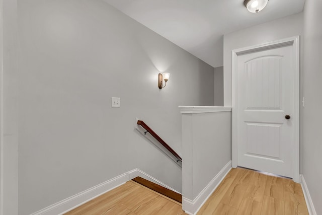 stairway featuring hardwood / wood-style flooring