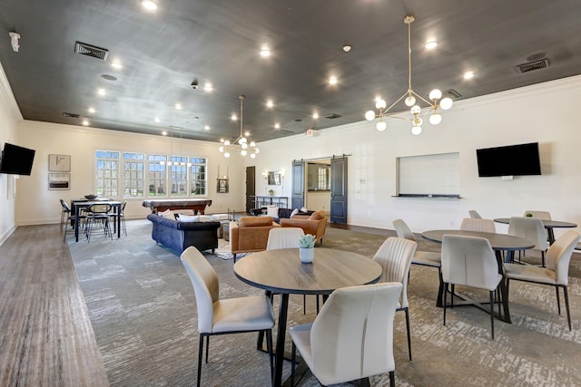 dining area with carpet floors, crown molding, an inviting chandelier, and pool table