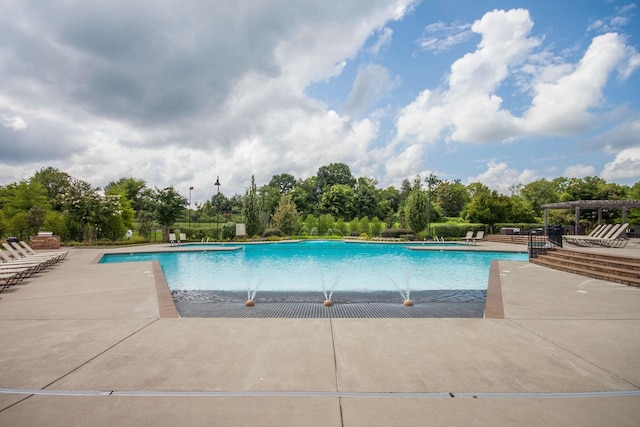 view of swimming pool featuring a pergola and a patio area