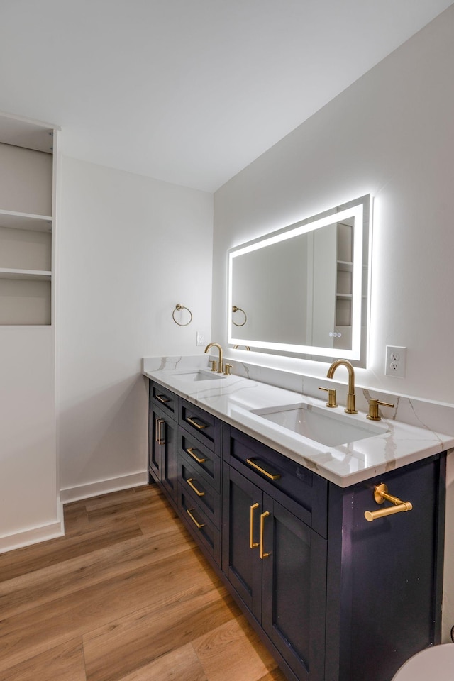 bathroom featuring vanity and hardwood / wood-style flooring