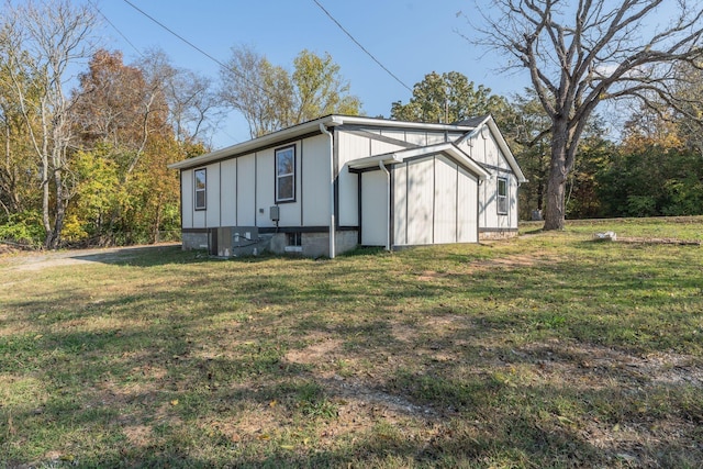 view of property exterior with a lawn