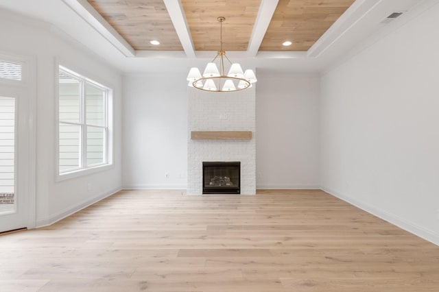 unfurnished living room featuring wooden ceiling, light wood-type flooring, a fireplace, beamed ceiling, and a chandelier