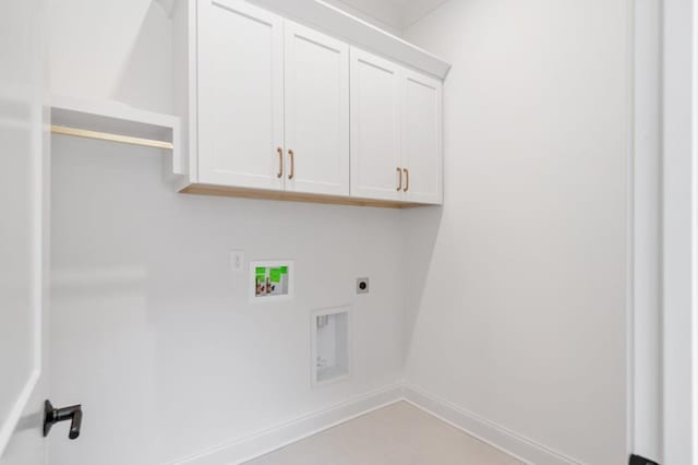 laundry room with cabinets, washer hookup, and electric dryer hookup