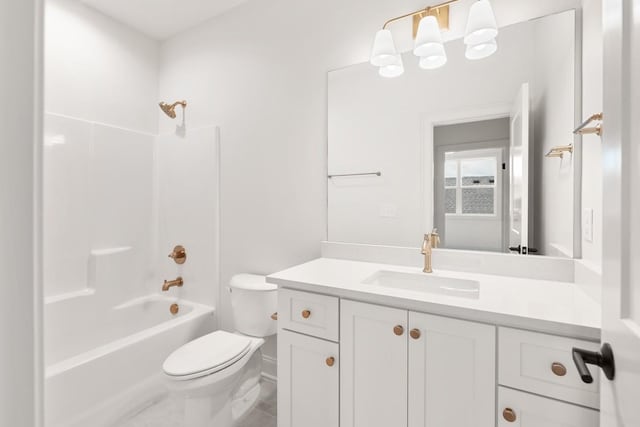 full bathroom featuring vanity, toilet, and washtub / shower combination