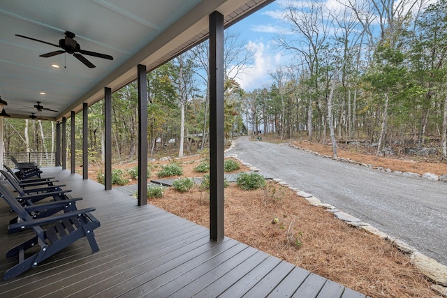 wooden terrace featuring ceiling fan