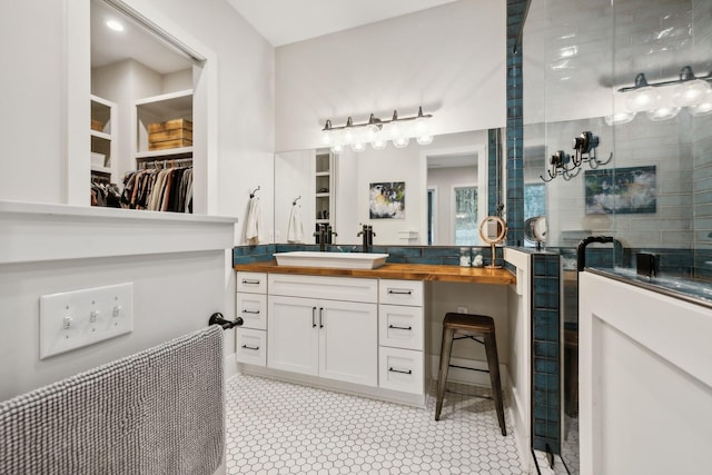 bathroom featuring vanity, wine cooler, and walk in shower