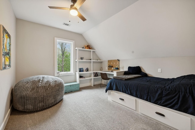 carpeted bedroom with ceiling fan and lofted ceiling