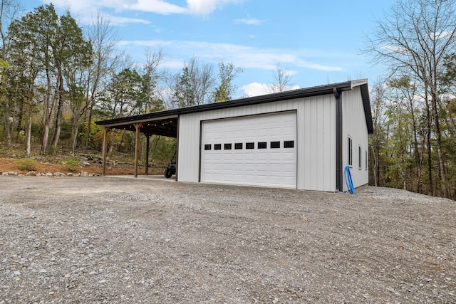 garage featuring a carport