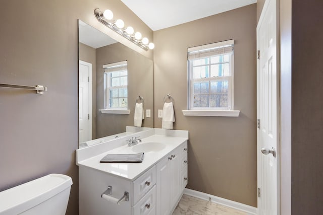 bathroom with vanity and toilet