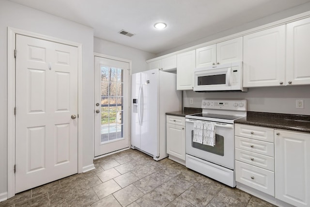 kitchen with white cabinets and white appliances