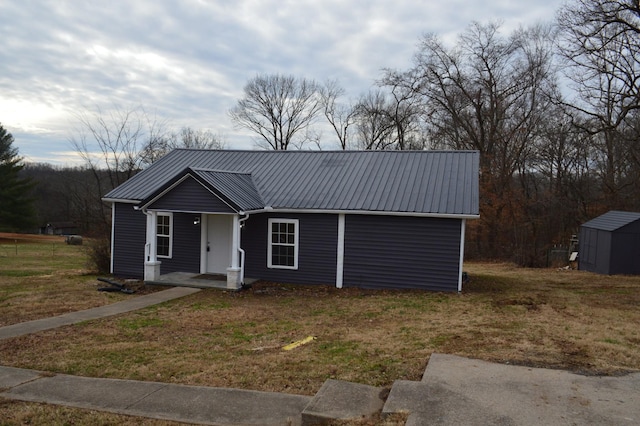 ranch-style house with a storage unit