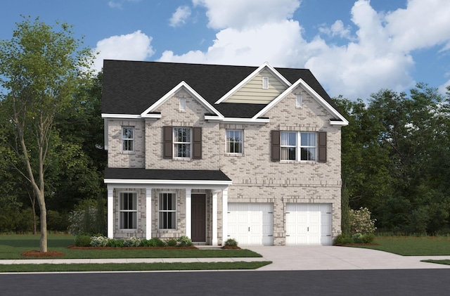 view of front of property featuring a garage and a front lawn