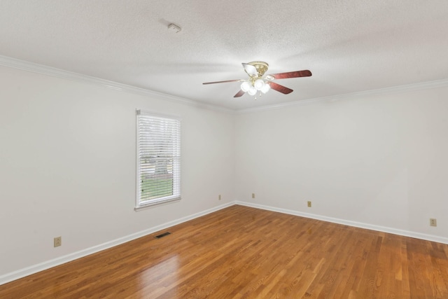 unfurnished room featuring hardwood / wood-style flooring, crown molding, and a textured ceiling