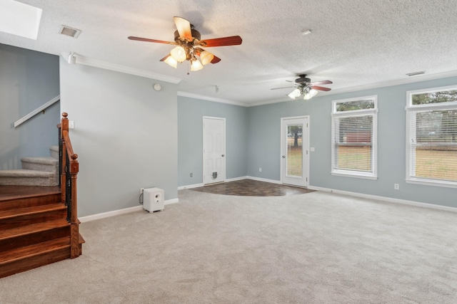 unfurnished living room with crown molding, ceiling fan, light colored carpet, and a textured ceiling