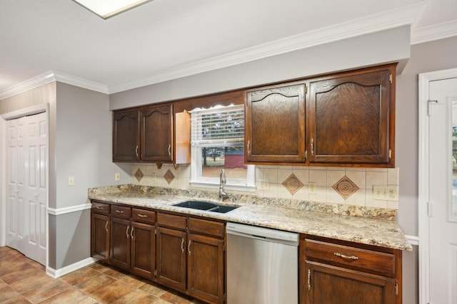 kitchen featuring dishwasher, light tile patterned floors, crown molding, and sink