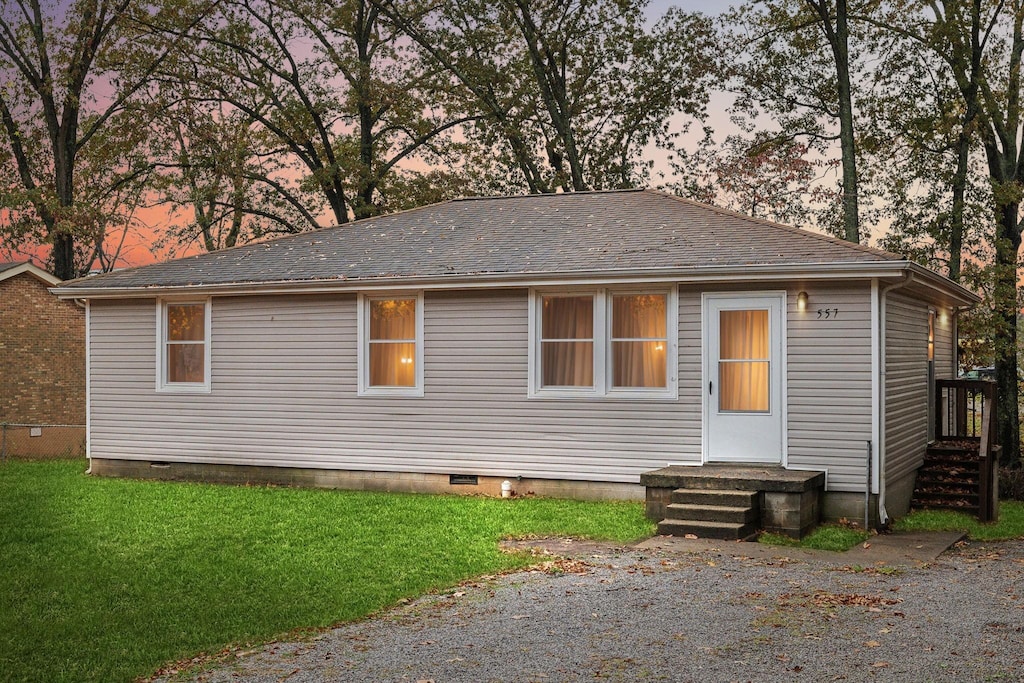 view of front of property with a yard