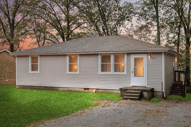 view of front of property with a yard