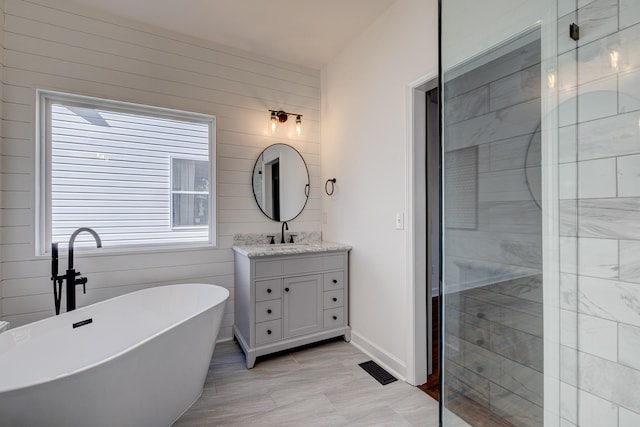 bathroom featuring vanity, tile patterned flooring, and independent shower and bath