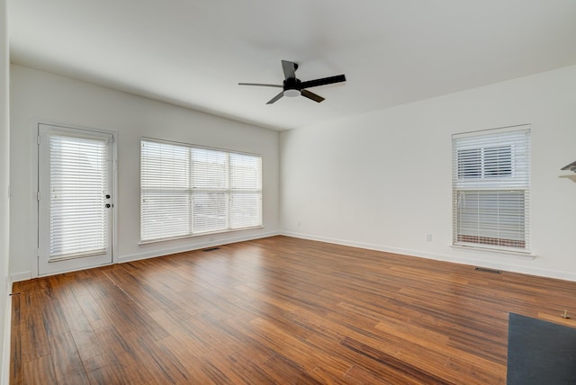 unfurnished room with hardwood / wood-style flooring and ceiling fan