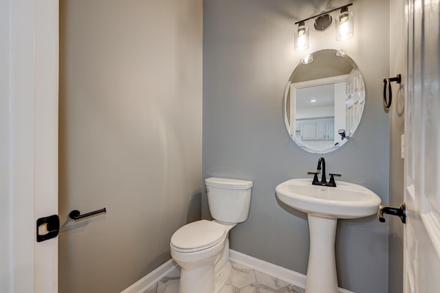 bathroom with sink and toilet