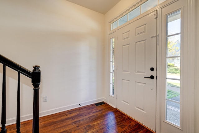 foyer entrance with dark hardwood / wood-style flooring