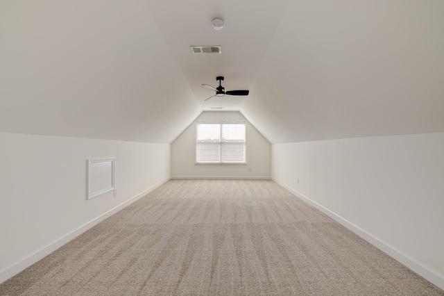 bonus room with ceiling fan, lofted ceiling, and light colored carpet