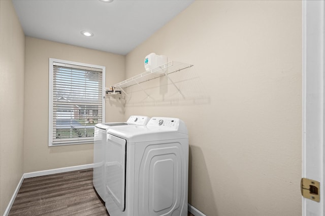 laundry room featuring independent washer and dryer and wood-type flooring