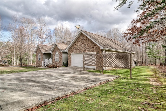 ranch-style house featuring a front yard and a garage