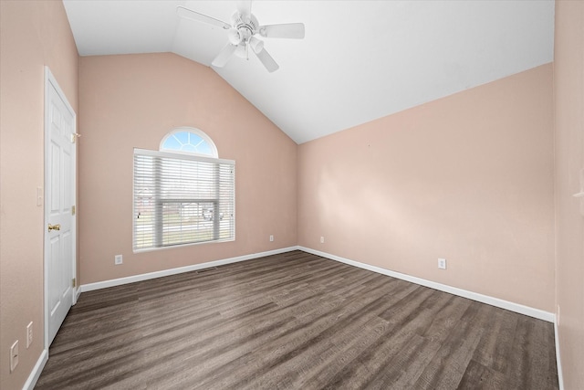 empty room with ceiling fan and vaulted ceiling